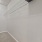 a white wall with a bench