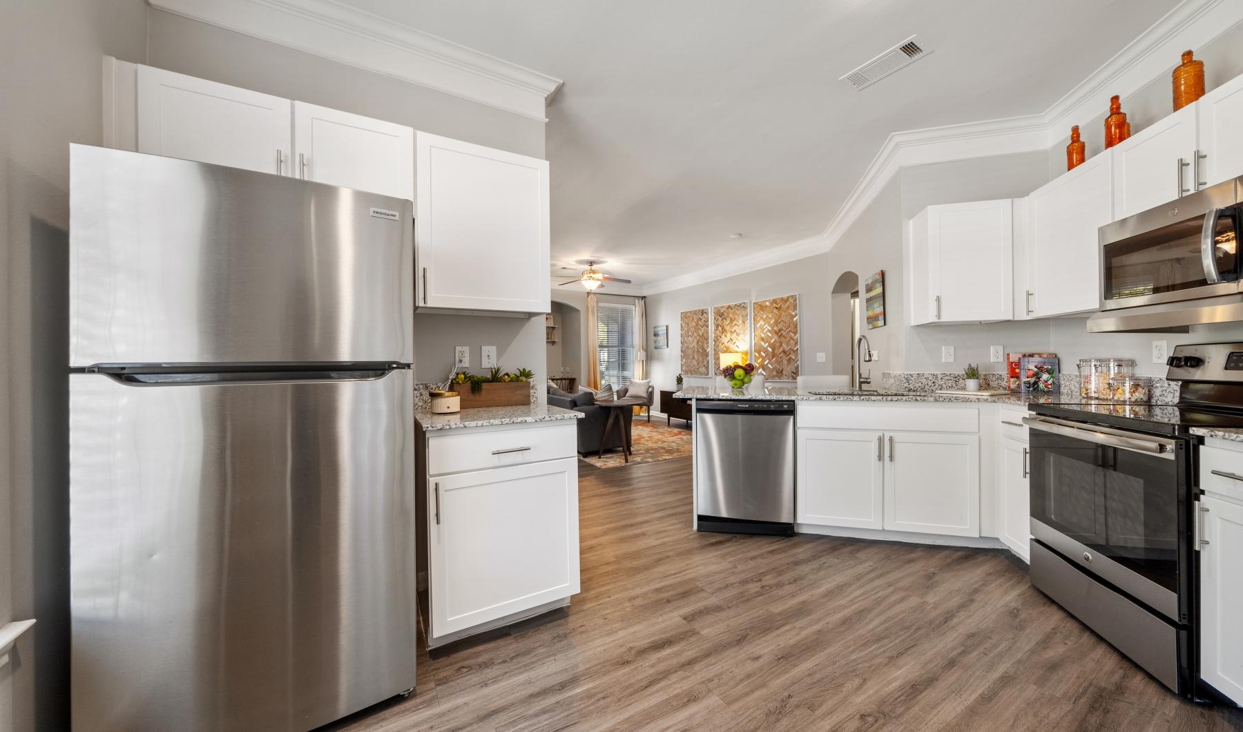 Settle into comfort at Bristol Heights a kitchen with white cabinets