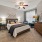 a bedroom with a bed and a desk
