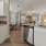 a kitchen with white cabinets