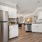 a kitchen with white cabinets